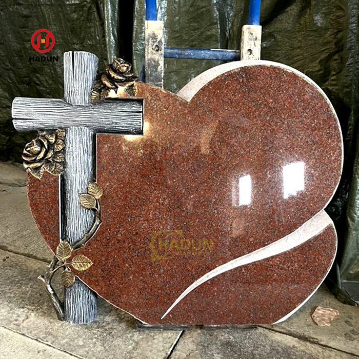 Tombstone Monument Granite stone sculpture roses and cross with cemetery flowers