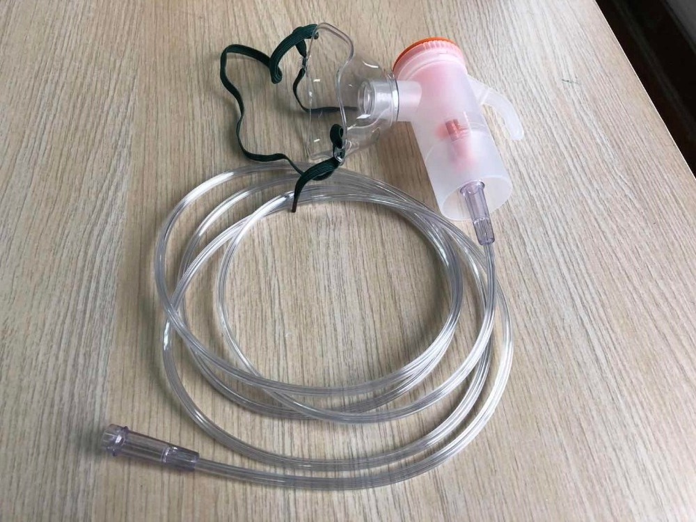 Hand holding Nebulizer mask kit with tube Tubing  nebulizer bottle  aerosol Cup 6ml  20ml  with mouth piece