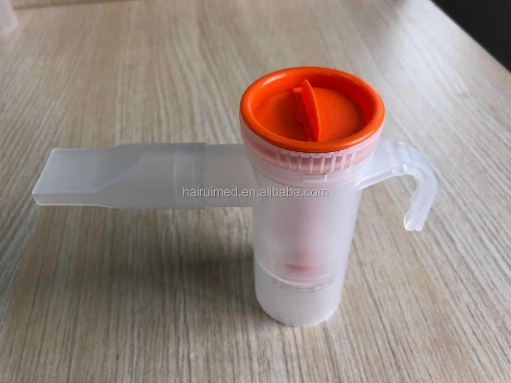 Hand holding Nebulizer mask kit with tube Tubing  nebulizer bottle  aerosol Cup 6ml  20ml  with mouth piece