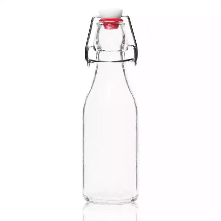 Wholesale Small 100ml Clear Round Glass Cold Juice Bottles with Swing Top