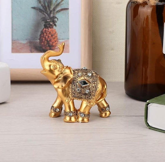 Resin gold elephant decorated statue. Good luck decorated with elephant statues