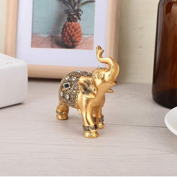 Resin gold elephant decorated statue. Good luck decorated with elephant statues