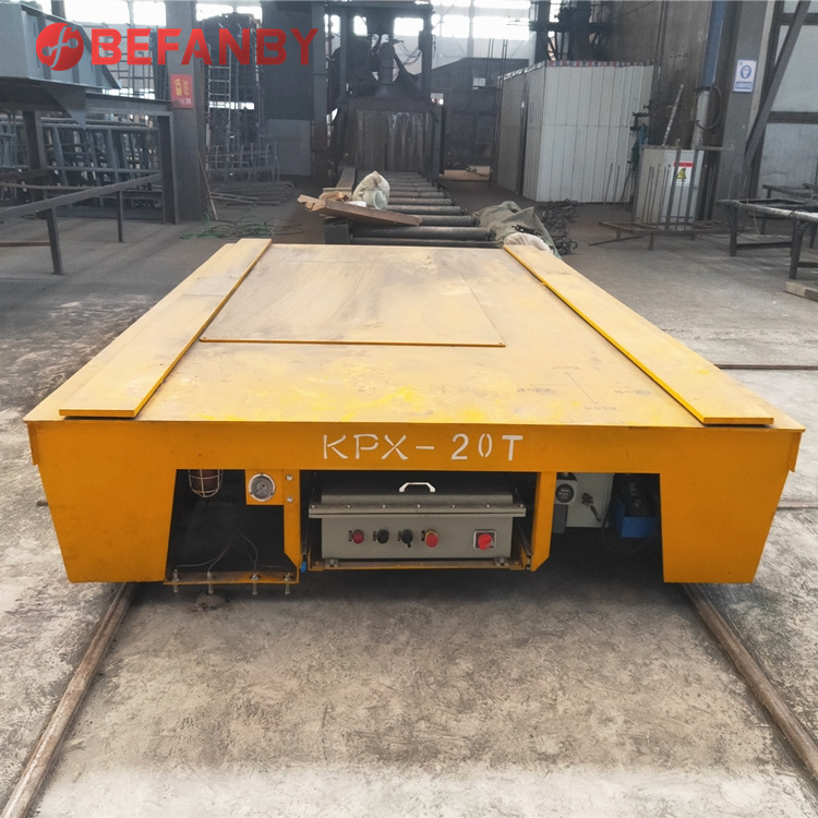 Steerable turning motorized material handling on rail transfer cart