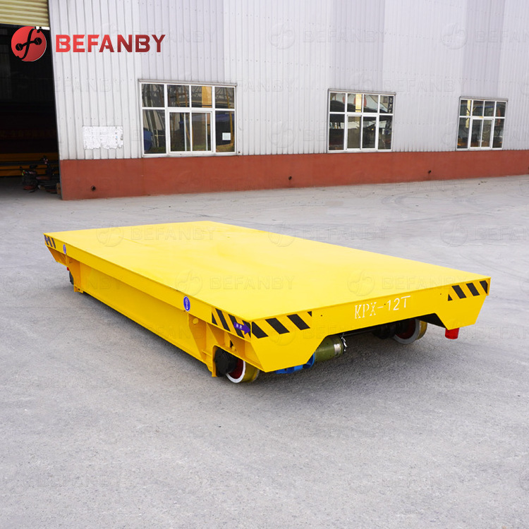 Steerable turning motorized material handling on rail transfer cart