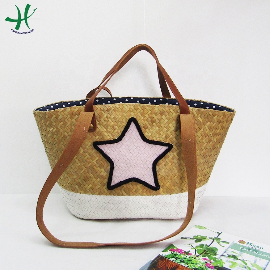 Handwoven New design seagrass bag woven handbag with pom pom/ natural summer straw handbag