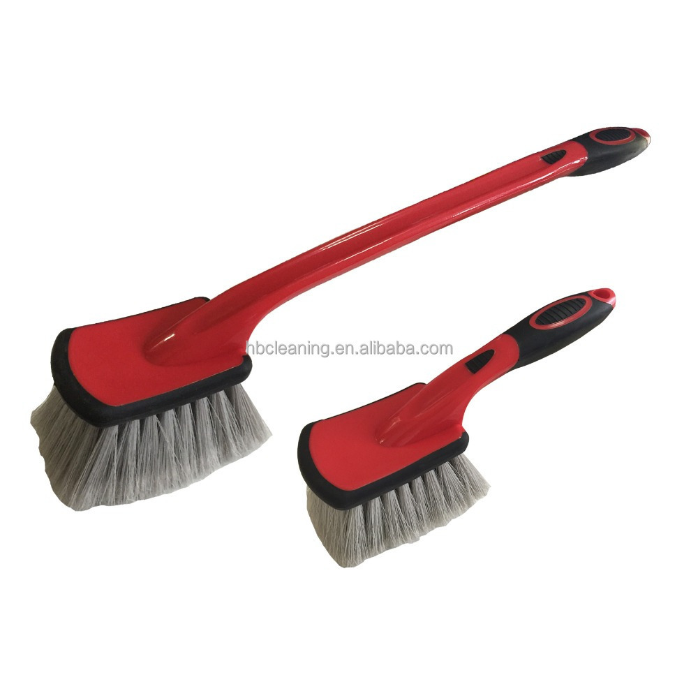 professional automatic car wheel cleaning brushes in hand