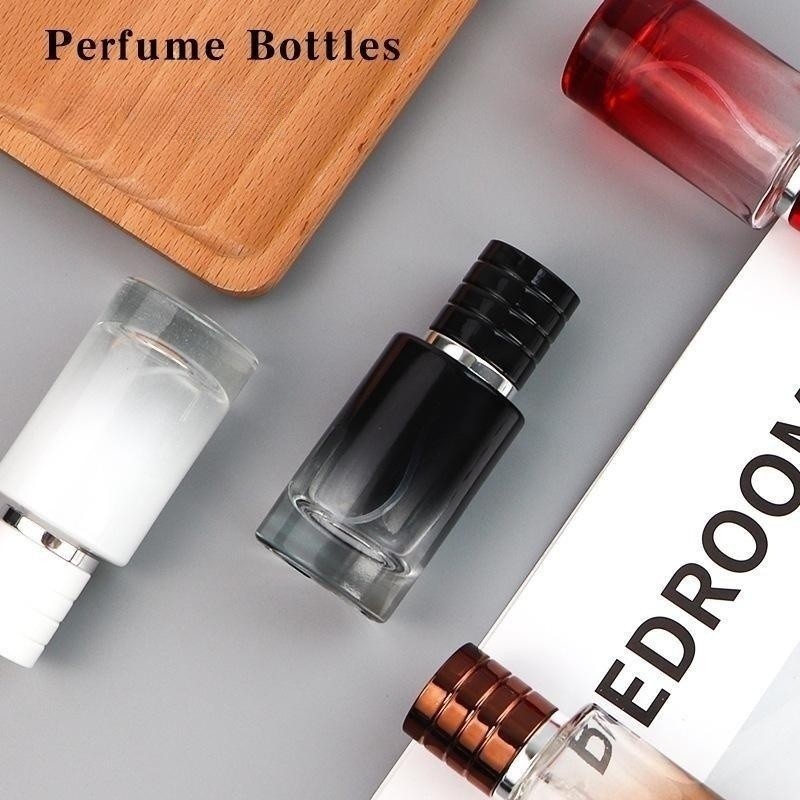 Luxury Cosmetic Packaging Portable cylinder gradient black glass 30ml perfume bottle with press spray