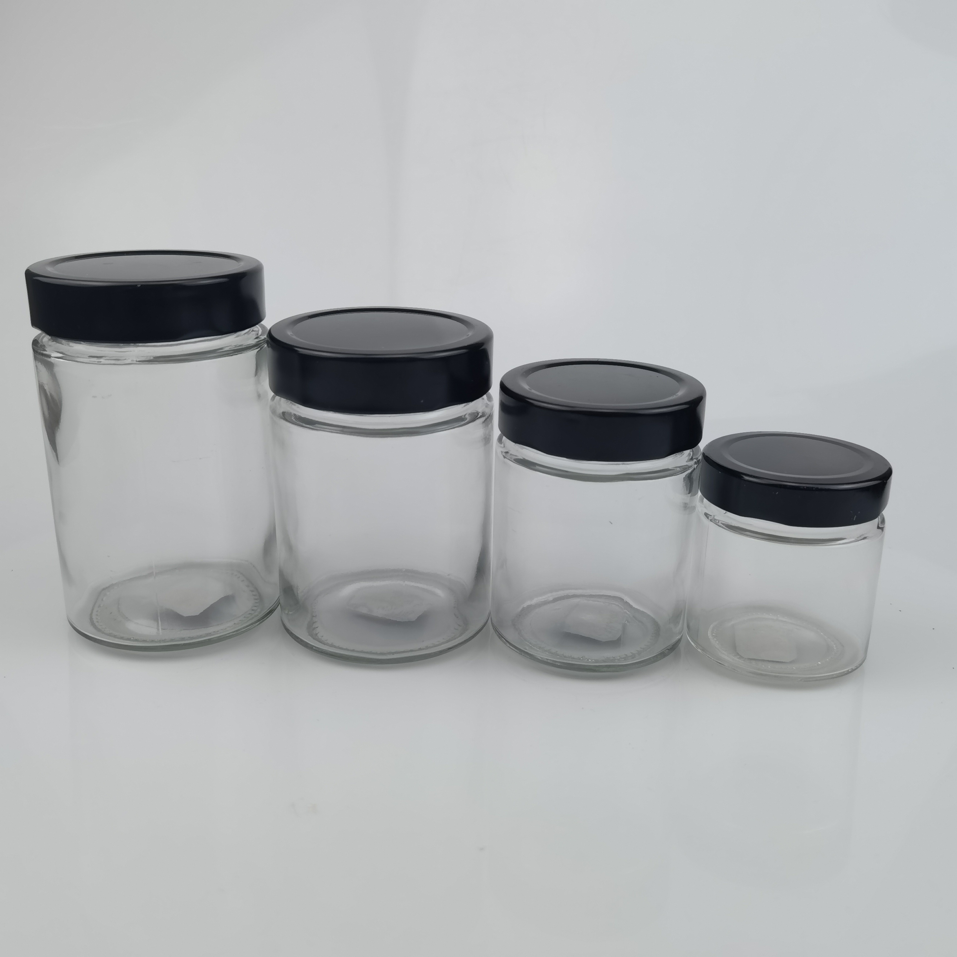 Factory Price 100 ML 220 ML 280 ML 500 ML Ergo Straight Round Side Ergo Glass Honey Jars With Twist Off Lids