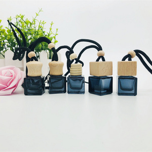 Wholesale 10ml air freshener diffuser empty frosted black car hanging perfume bottle with wooden cap