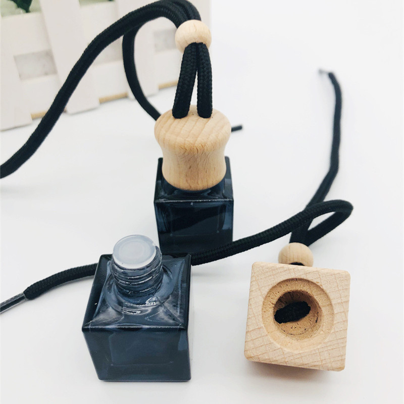 Wholesale 10ml air freshener diffuser empty frosted black car hanging perfume bottle with wooden cap