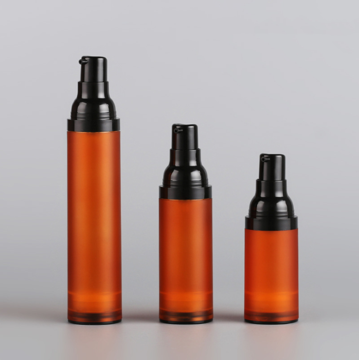 Stock matte orange cosmetic airless bottle 15ml 30ml 50ml empty facial serum lotion container plastic pump spray bottles