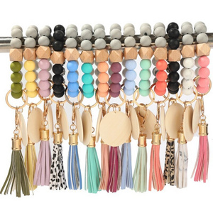 Top Selling Colorful Monogram Leather Tassel Bracelet Keychains Silicone Bead Wristlet Wood Blank Disc For Keychain