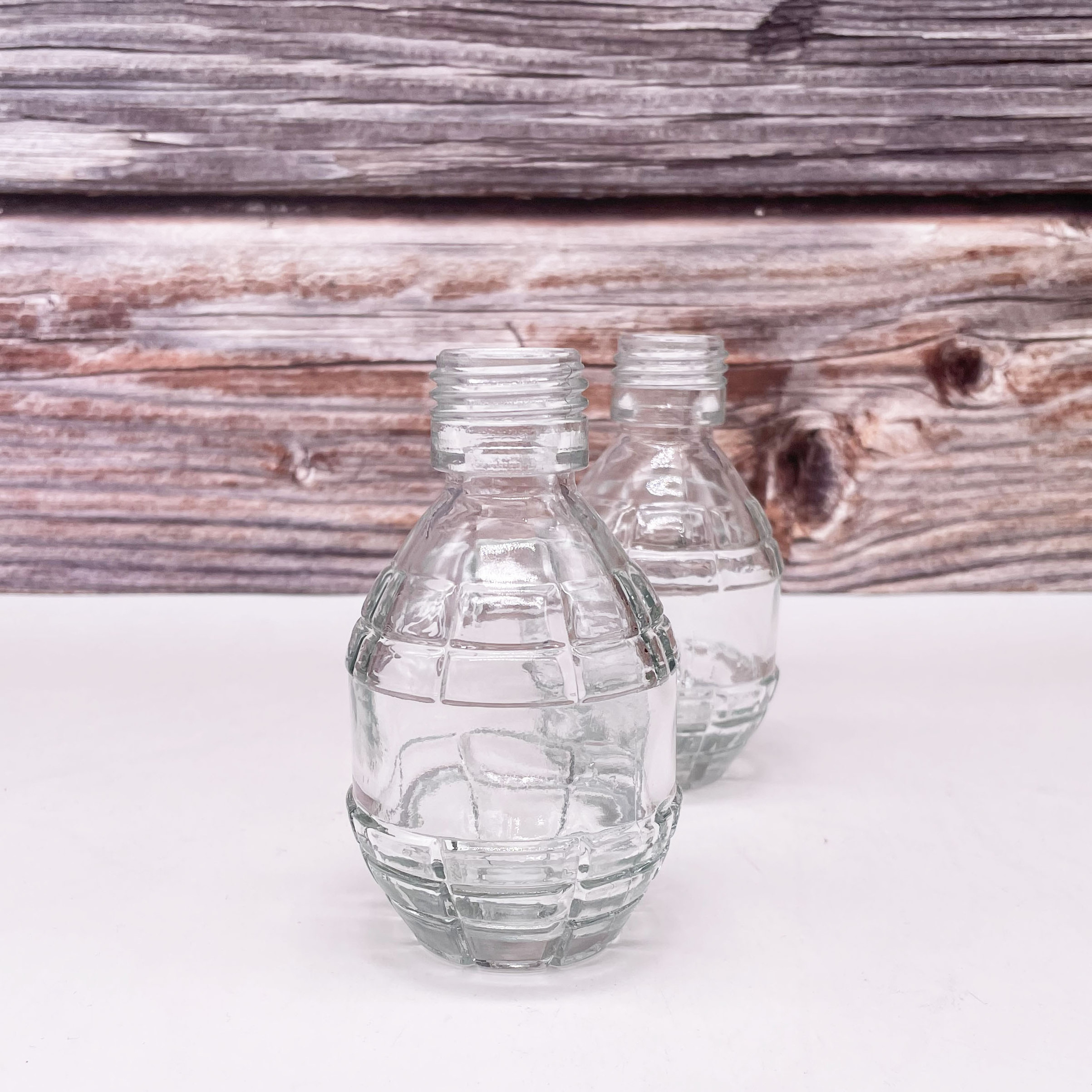 Hot Factory Price Unique Fashion Grenade Shaped Seal Fresh Eco Friendly Juice Glass Bottle for Beverage