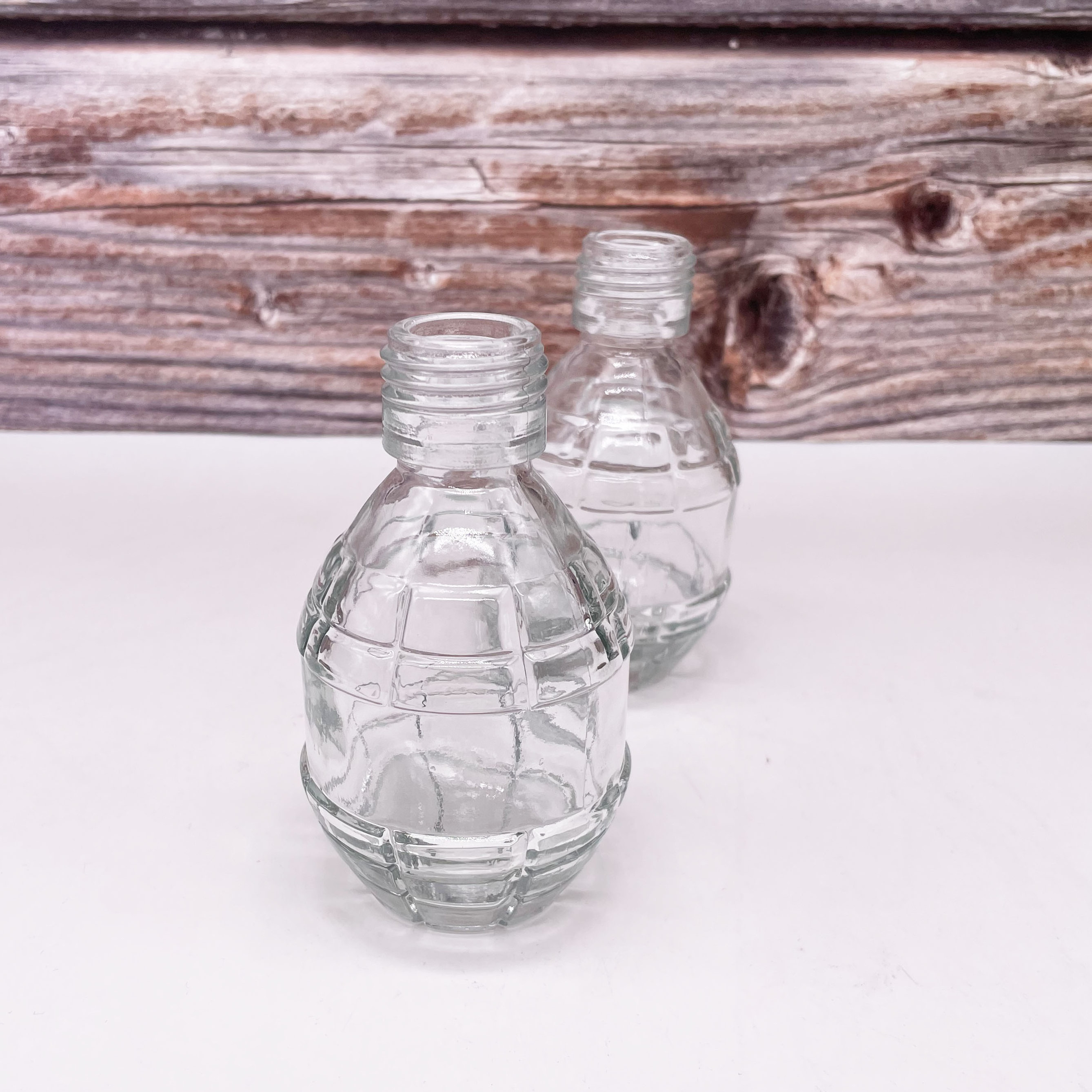 Hot Factory Price Unique Fashion Grenade Shaped Seal Fresh Eco Friendly Juice Glass Bottle for Beverage