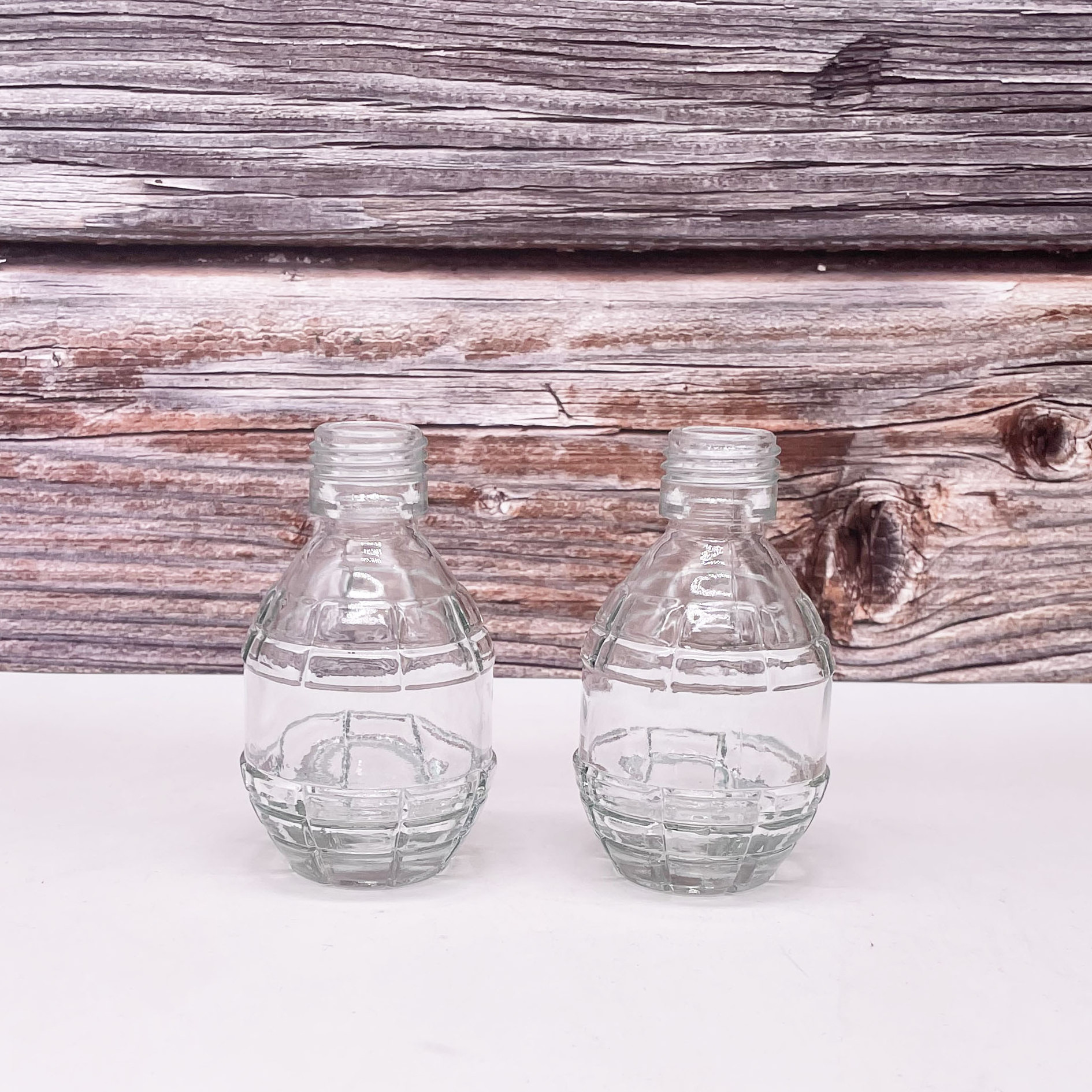 Hot Factory Price Unique Fashion Grenade Shaped Seal Fresh Eco Friendly Juice Glass Bottle for Beverage