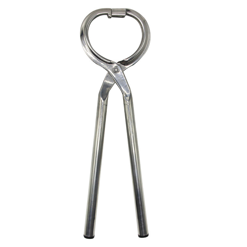 A large stainless steel pliers that can punch a calf's nose to fit a large bull nose ring