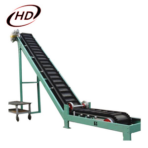 Large angle side wall conveyor belt for sawdust/quarry