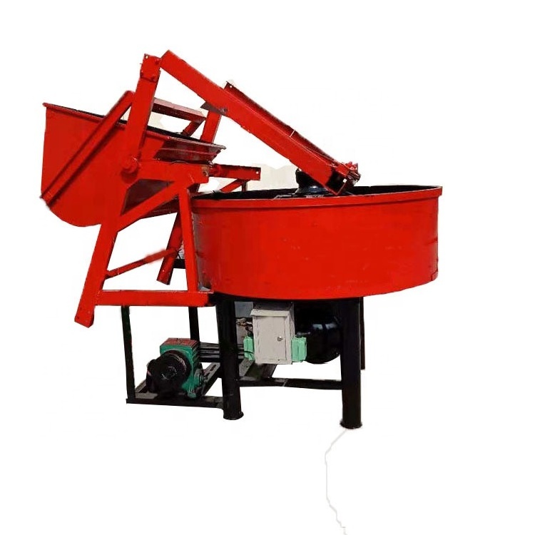 Vertical self loading concrete pan mixer