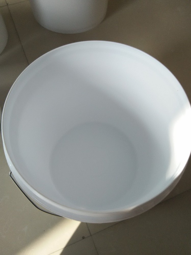 white plastic bucket with metal lid