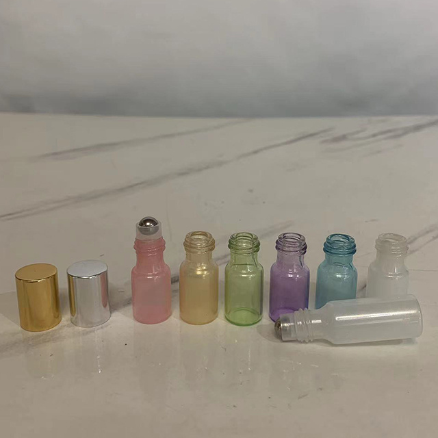 Hengjian luxury 3ml 5ml 10ml purple yellow green white pink blue perfume glass vial roller ball bottles with gold silver cap