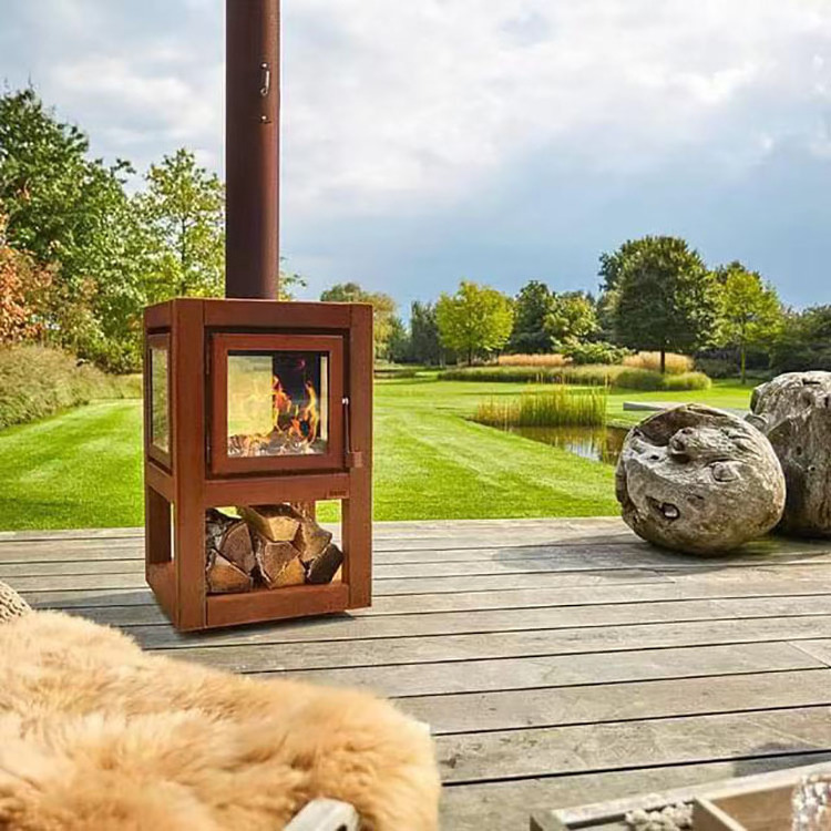 Outdoor antique rusty corten steel metal fireplace with chimney