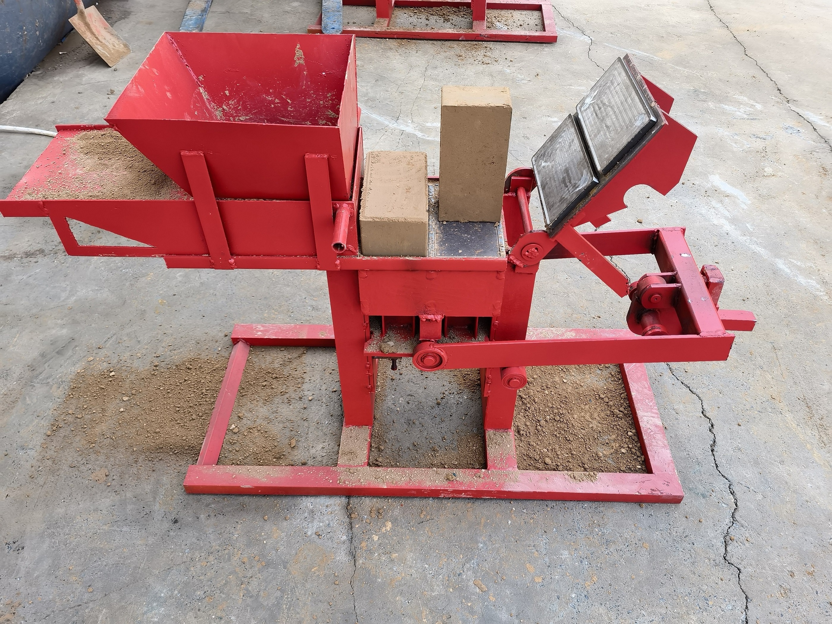 Manual brick machine customized molds to produce Lego clay solid bricks.manual interlocking soil clay brick making machine