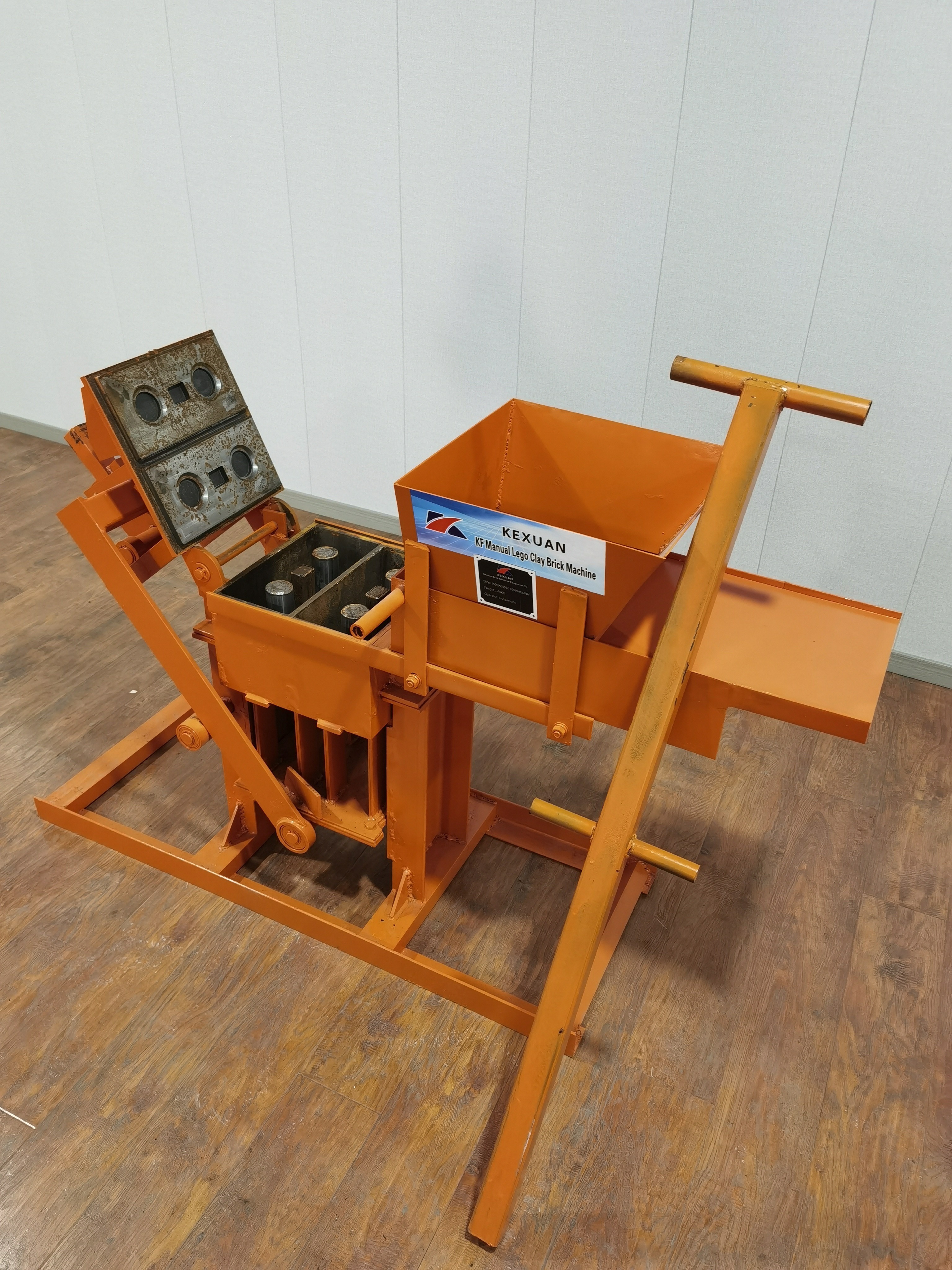 Manual brick machine customized molds to produce Lego clay solid bricks.manual interlocking soil clay brick making machine