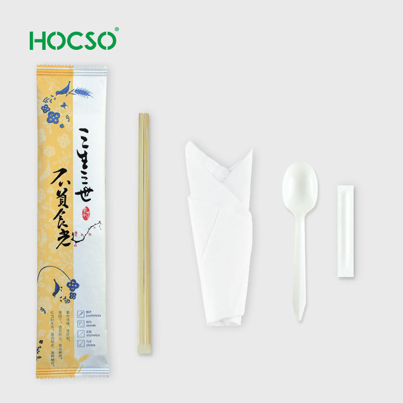 Chinese cutlery kit include disposable chopstick and spoon wrapped with napkin in paper pouch