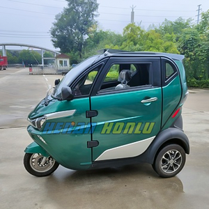 Enclosed electric mobility scooter with seat cover roof