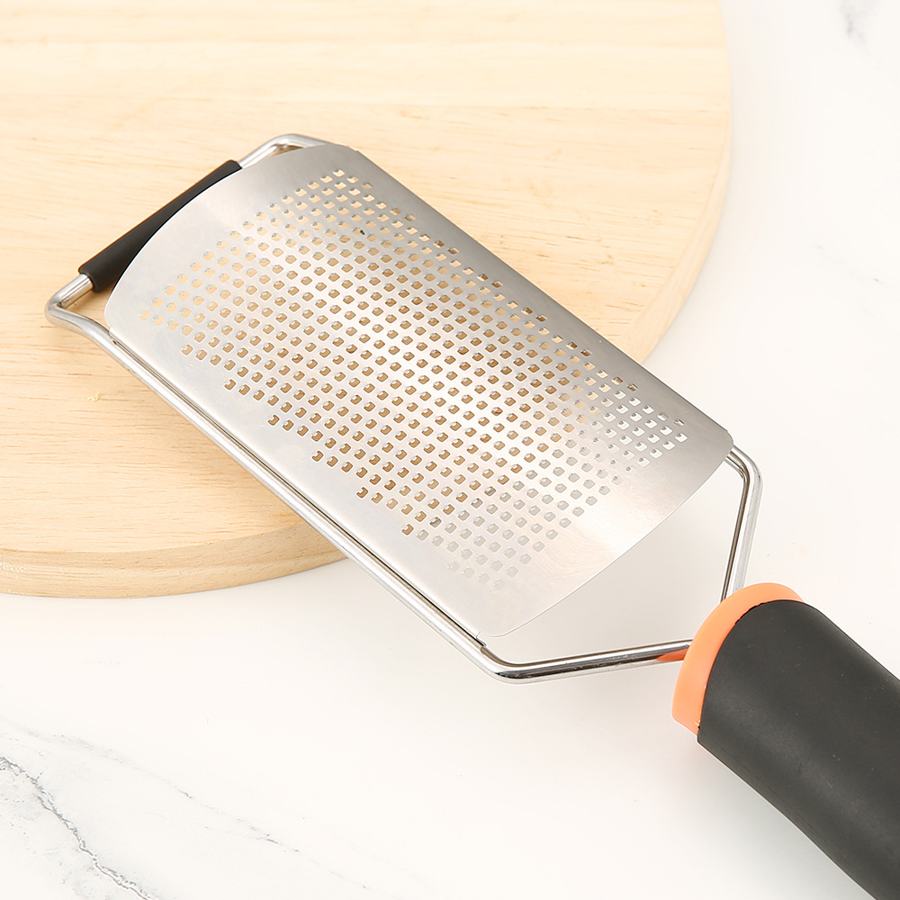 Stainless steel grater for cheese and lemon with plastic handle