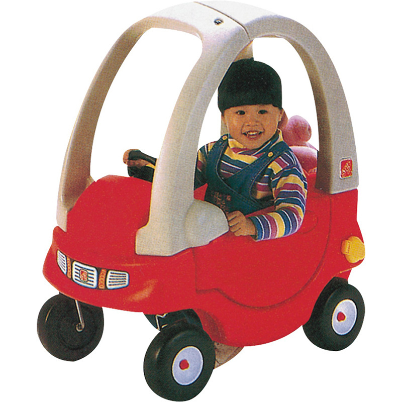 Kindergarten school children play toy ride on car for kids in India