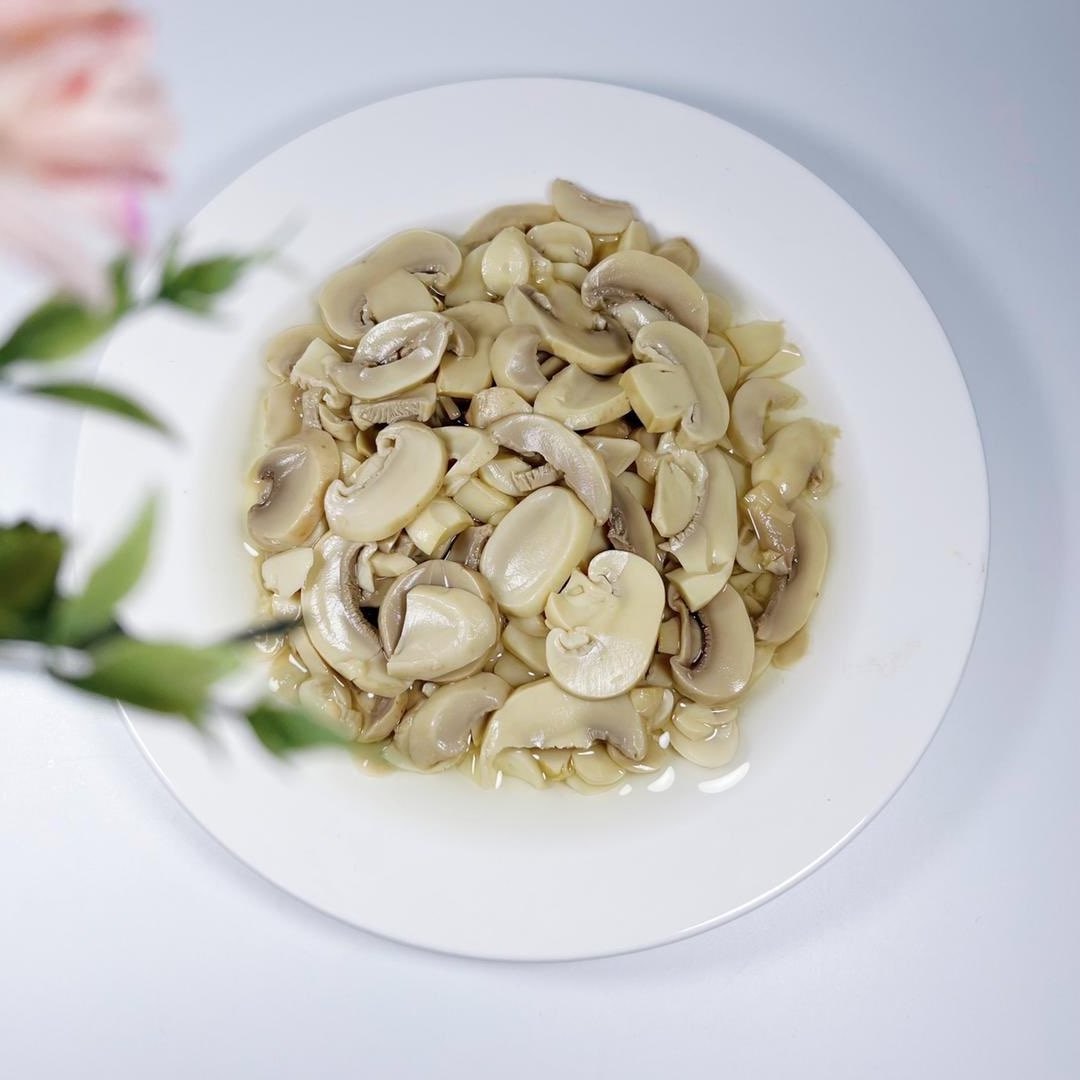 canned champignon button mushroom in tins slice pieces and stem