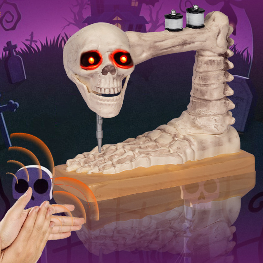 A voice-activated sewing machine is decorated with a moving skeleton Halloween prop