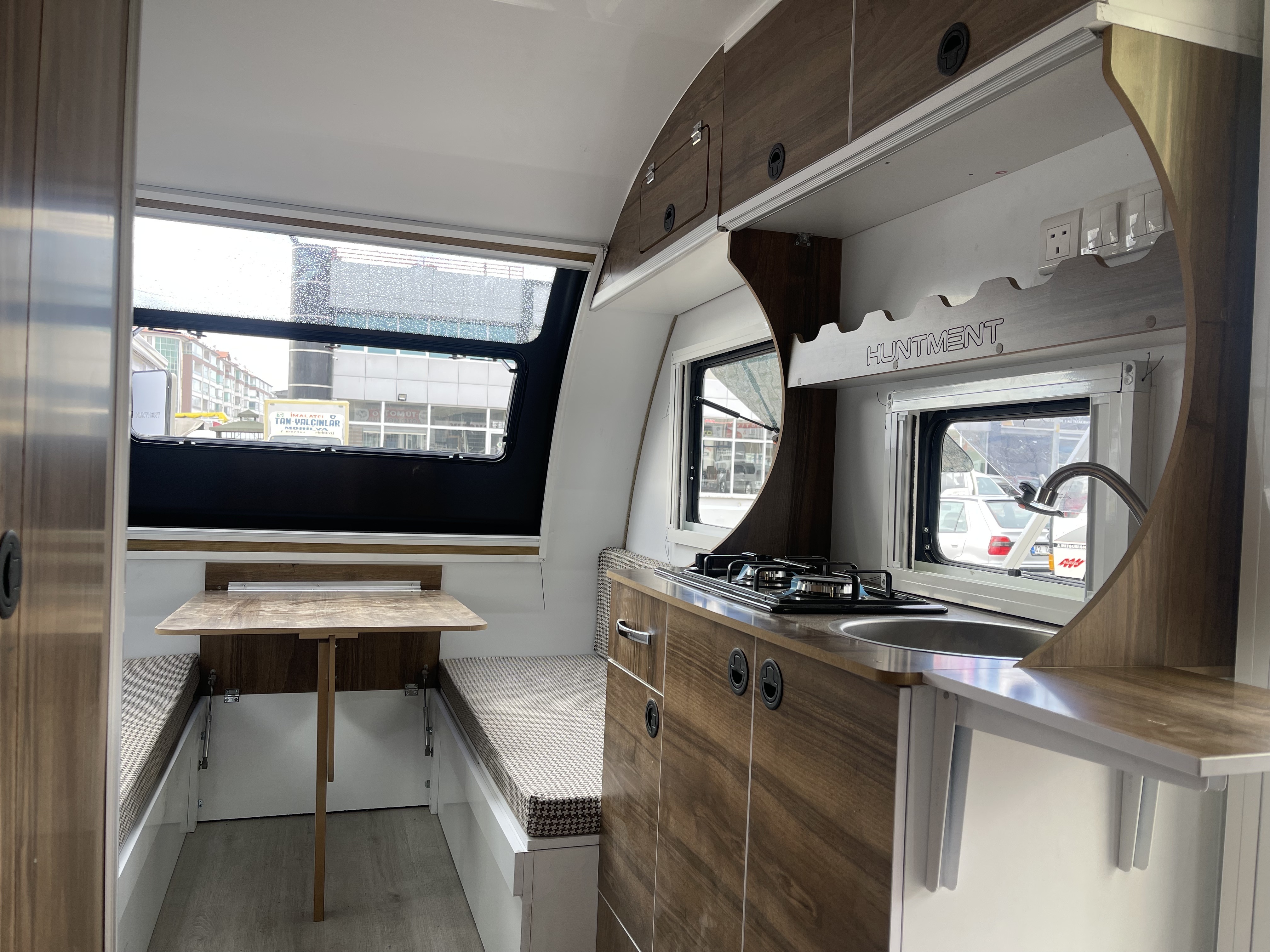 Embark on Eco-Friendly Adventures with HUNTMENT: Luxurious 4X4 Caravan Motorhome Featuring Green Energy and Slide-Out Kitchen!