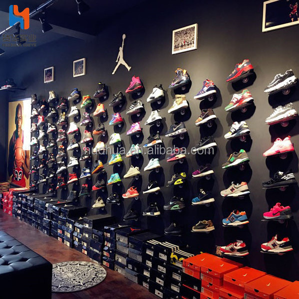 huohua stable metal material install on the wall shoe shop rack