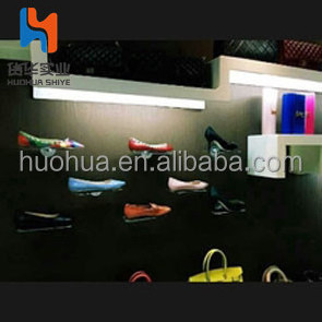 huohua stable metal material install on the wall shoe shop rack