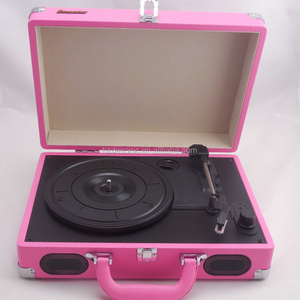 Pink record player or turntable with phonograph and tonearm turntable