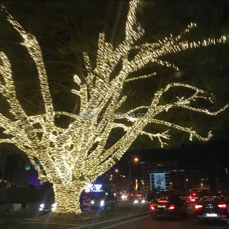 Outdoor connectable tree fairy Christmas lights on tree trunks for winter garden park light show