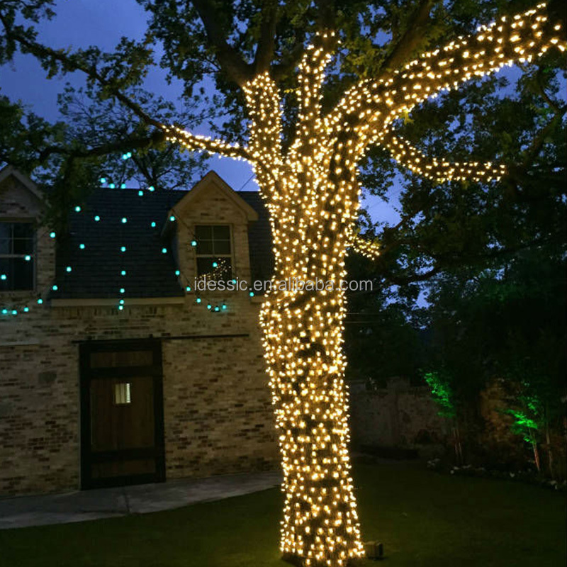 Outdoor connectable tree fairy Christmas lights on tree trunks for winter garden park light show