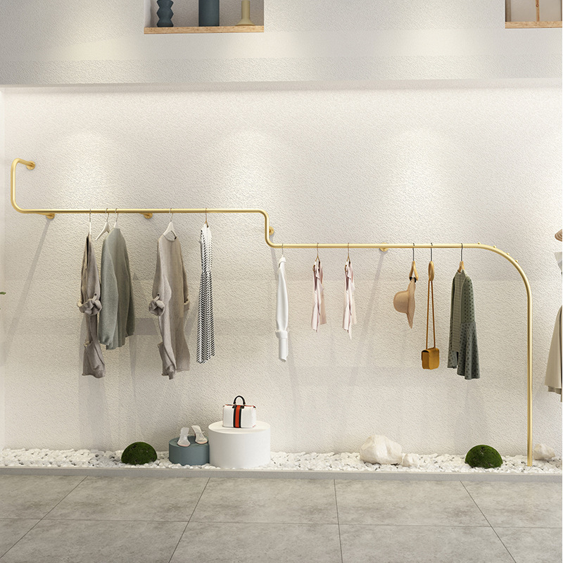 Luxury iron hanging clothes rack, Clothing shop wall mounted garment display rack, Long golden online clothes display rack