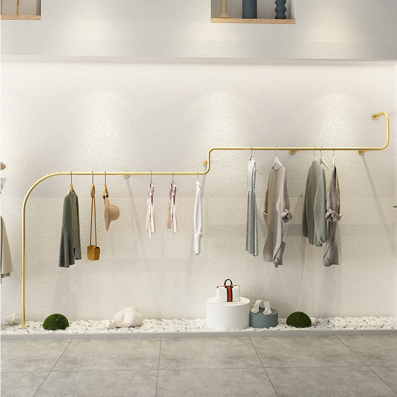 Luxury iron hanging clothes rack, Clothing shop wall mounted garment display rack, Long golden online clothes display rack