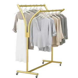 Luxury modern stainless steel wheel moving clothes hanging boutique gold clothing rack for clothing store