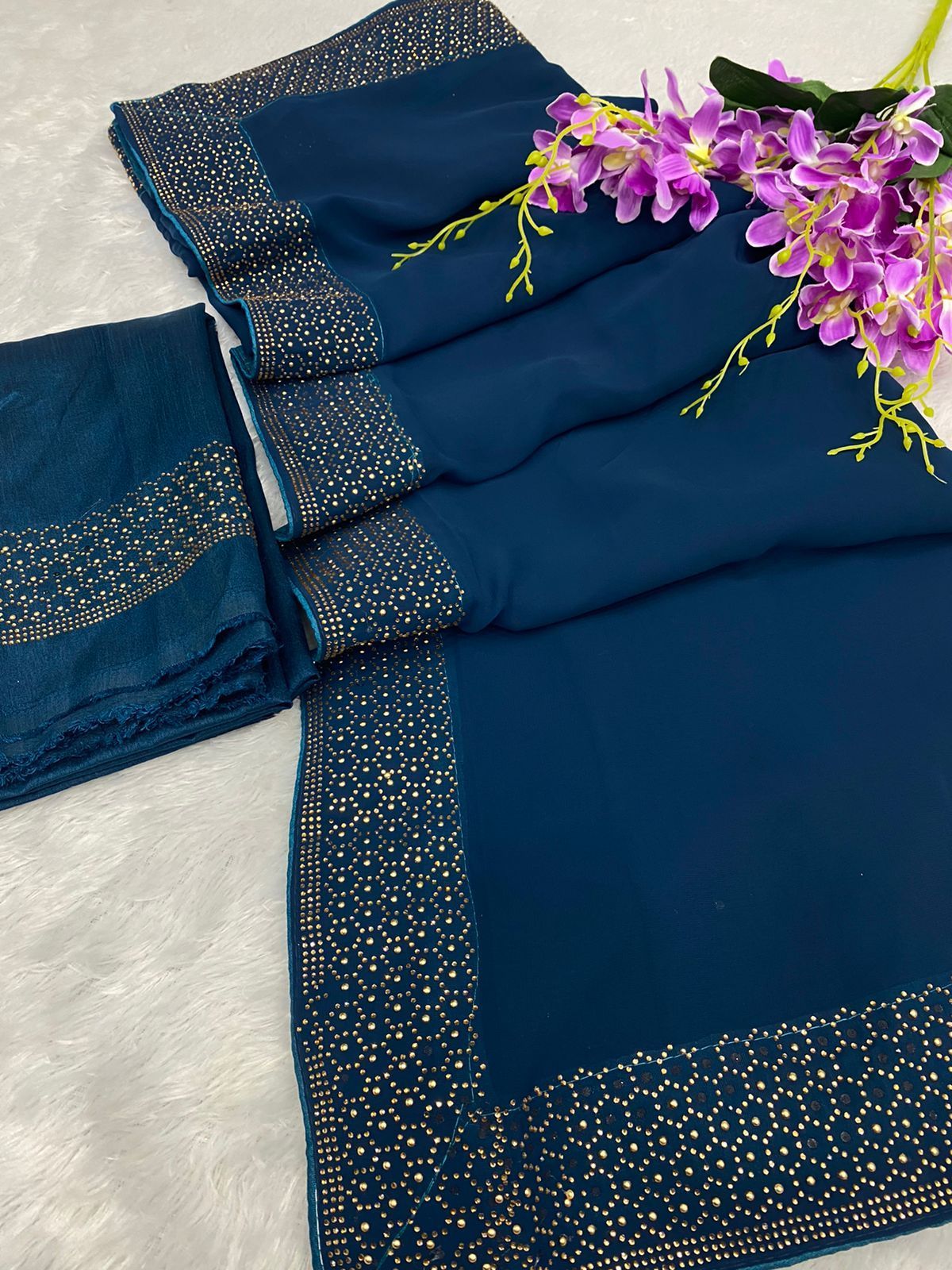 Georgette is a type of crepe fabric that is typically made from pure silk but can also be made from synthetic fibers like