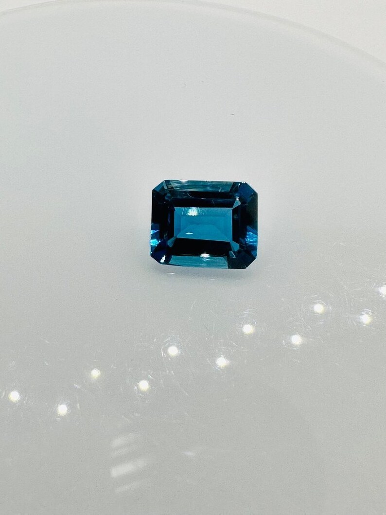 Custom Gemstone Manufacturer Natural London Blue Topaz Emerald Cut 12x16mm Big Loose Gemstone Faceted Lab Grown Blue Topaz Hydro