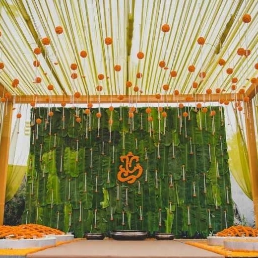 Digital Printed Banana Leaf Curtain Backdrop Decoration with Small Yellow Flower Hangings for Pooja Housewarming and Wedding