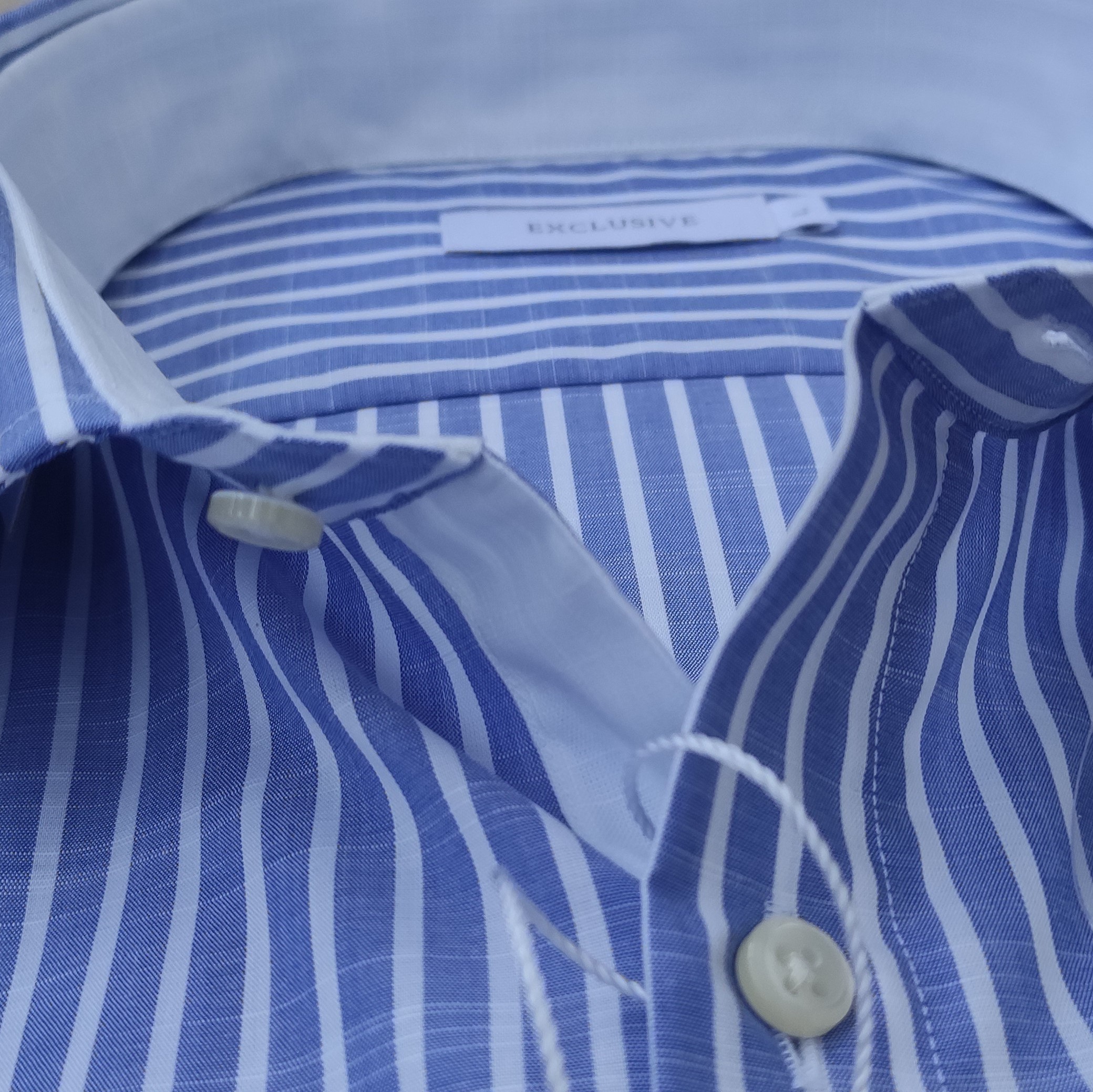 Men shirt in 100% high quality slub cotton white blue stripes following the Made in Italy tradition export