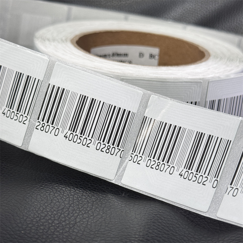 Wholesale e-Bit 8.2MHz Coated paper 4*4 cm White EAS system RF Soft Label with bar code for clothing shop anti-theft system