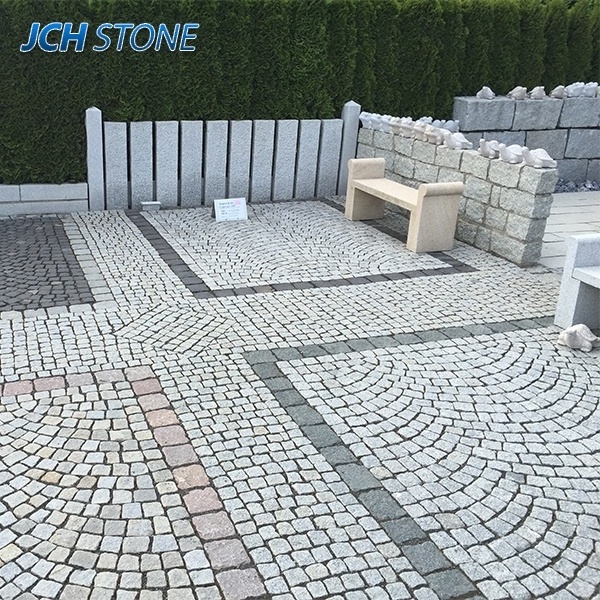 granite stone cubes pattern on mesh cobblestone paving stone Grauer Granit Wuerfel.Pflasterstein