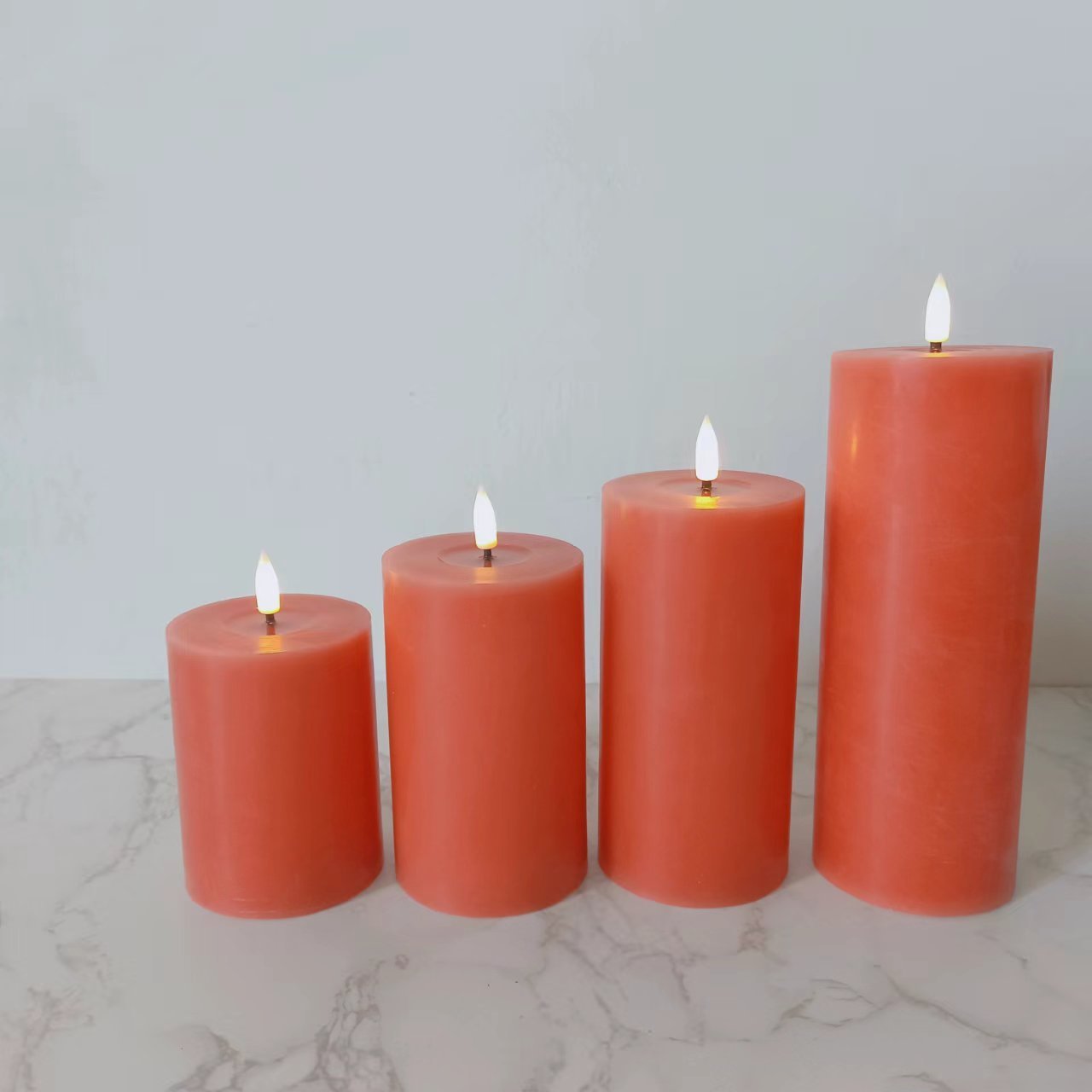 Wholesale Set of 4 Flickering Pumpkin Color Real Wax Column Battery Operated Remote Control LED Candles with Wax Oil Effect