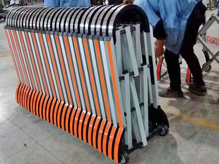 Flexible collapsible roadblock retractable barrier